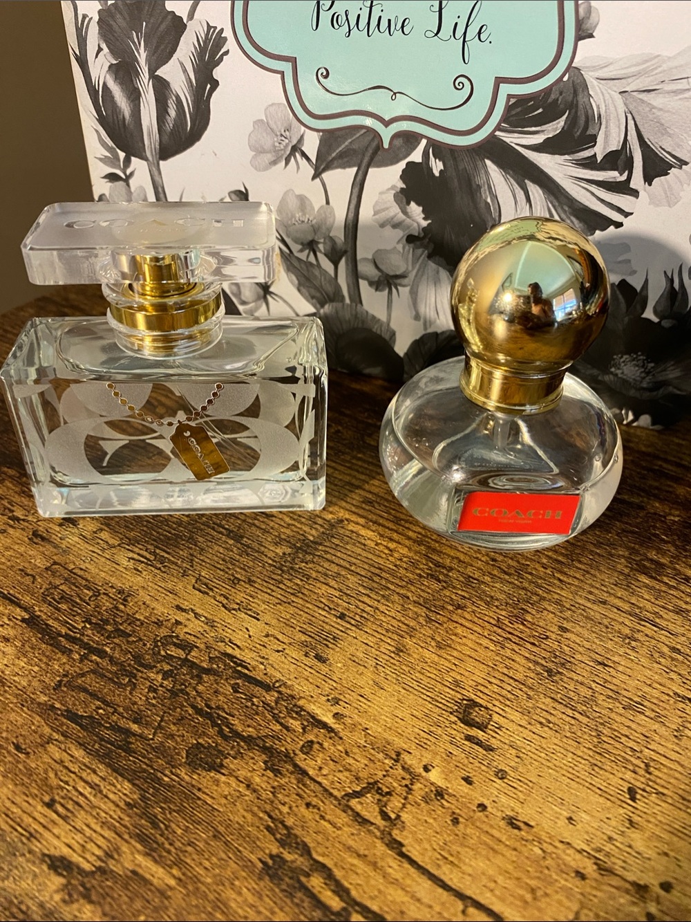 Two Coach Clear Glass Perfume Bottles